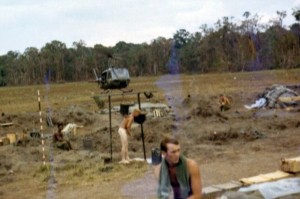 Arty crew member taking shower as chopper lands. There is no berm. The base is still being built. LZ Ranch, Snoul, Cambodia 1970 Photo: Mike Paestrella