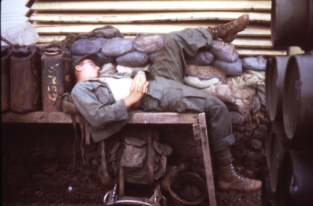 Medic at rest, 1/7 aid station, Phuc Vinh, Vietnam, 1970.