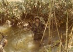 Gary Williams crossing stream. Song Be, Vietnam 1970