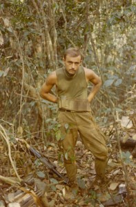 Jim Lamb in the bush getting ready for patrol. Song Be, 1969