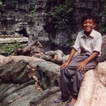 Mea sitting atop temple ruin, Ta'Prom, Angkor Wat, Cambodia, 1995.