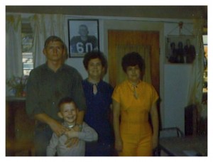 Gary Johnston, his younger brother, sister and mother. Texas, 1969