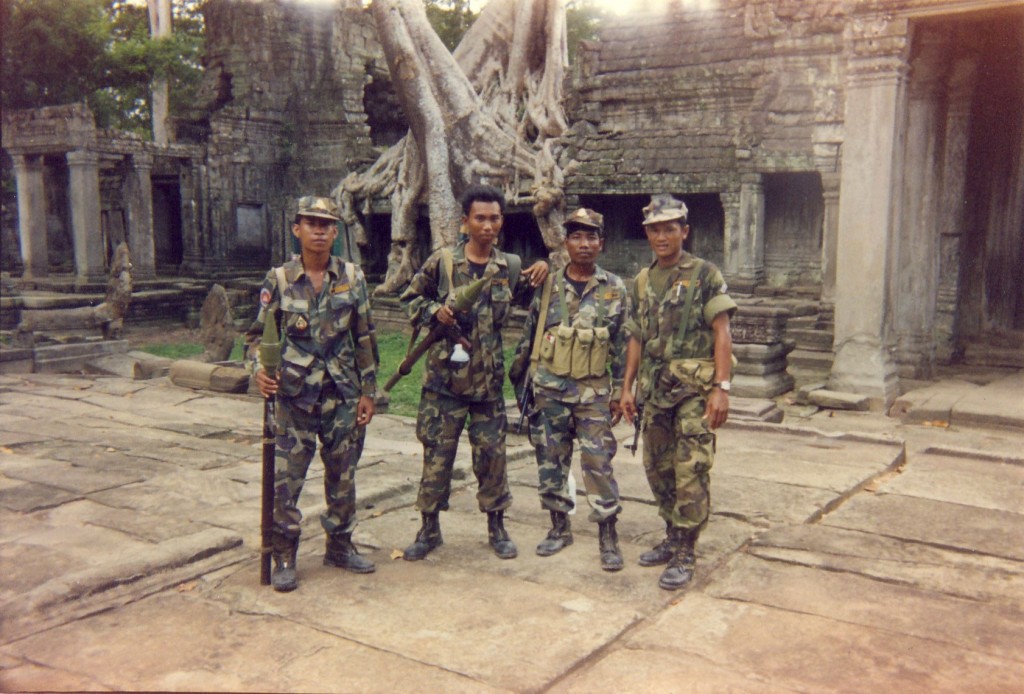 Tourist troops with B 40s and AK47s. Ta'Prom, Angkor Wat, Cambodia, 1995