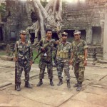Tourist troops with B 40s and AK47s. Ta'Prom, Angkor Wat, Cambodia, 1995