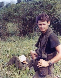 After a patrol Jeff Motyka waits in a field for inbound choppers. Tay Ninh,Vietnam 1970