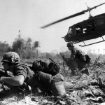 Combat operations at Ia Drang Valley,Vietnam,November 1965. Bruce P. Crandall's UH-1 Huey dispatches infantry while under fire. Photo US Army