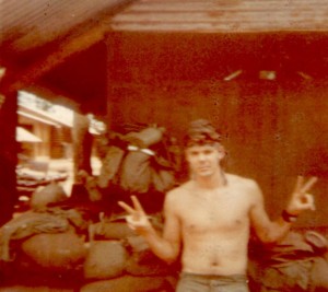 Sgt. Gary Kelch giving the peace sign. Quan Loi 1970  Photo  Jeff Motyka