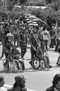 Vietnam veterans against the war and other anti-war activists march in protest near Convention Hall in Miami, Fla., Aug. 22, 1972, as the Republican National Convention opened. Disabled Vietnam vet Ron Kovic, holding an upside down American flag as a symbol of distress, is seen in the march. (AP Photo)