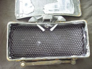  The photo shows the plastic matrix attached to the backside of the front wall, with the steel shot ("BBs") embedded in it. The silver cylinders are the fuze wells. There are 2 kilos of C4 packed behind it. When detonated, the steel BB's are thrown forward like a big shotgun blast. Grunts pried apart Claymores for the C4. A small ignited chunk could boil water in less than a minute. The fumes were posinous