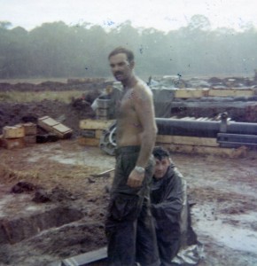 Mike Dunn putting in cross beams on LZ Ranch. Cambodia 1970